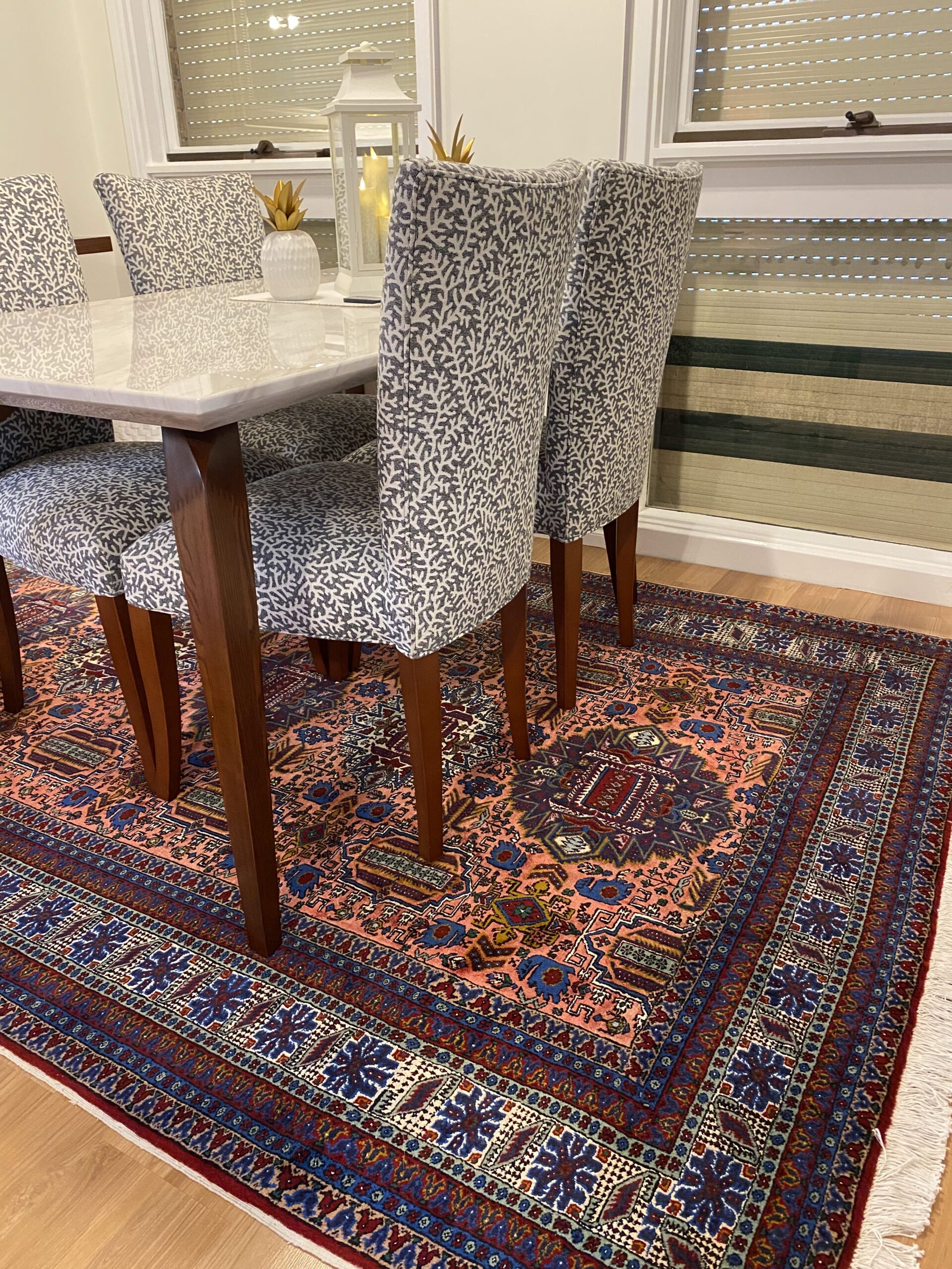 Image of a selection of premium materials used in crafting Persian rugs. The materials include soft and shiny wool sourced from carefully selected sheep and goats, fine silk derived from mulberry silkworm cocoons, and strong and durable cotton used for the rug's foundation. These high-quality materials contribute to the luxurious and expensive nature of Persian rugs.