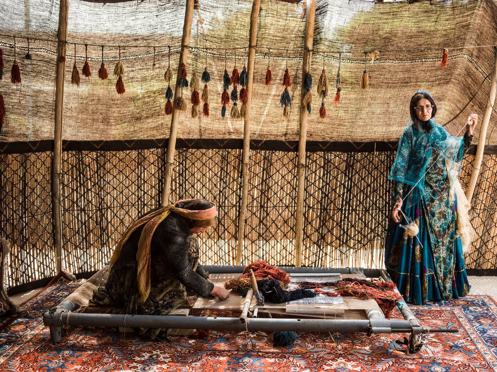 Image of a close-up view of the fibers in a Persian rug, highlighting the use of natural materials such as wool, silk, and cotton. Persian rugs made from synthetic materials such as nylon or polyester are unlikely to be authentic. It is important to check the label on the rug or consult with a professional if you are unsure about the materials used, as natural fibers are a key characteristic of genuine Persian rugs.
